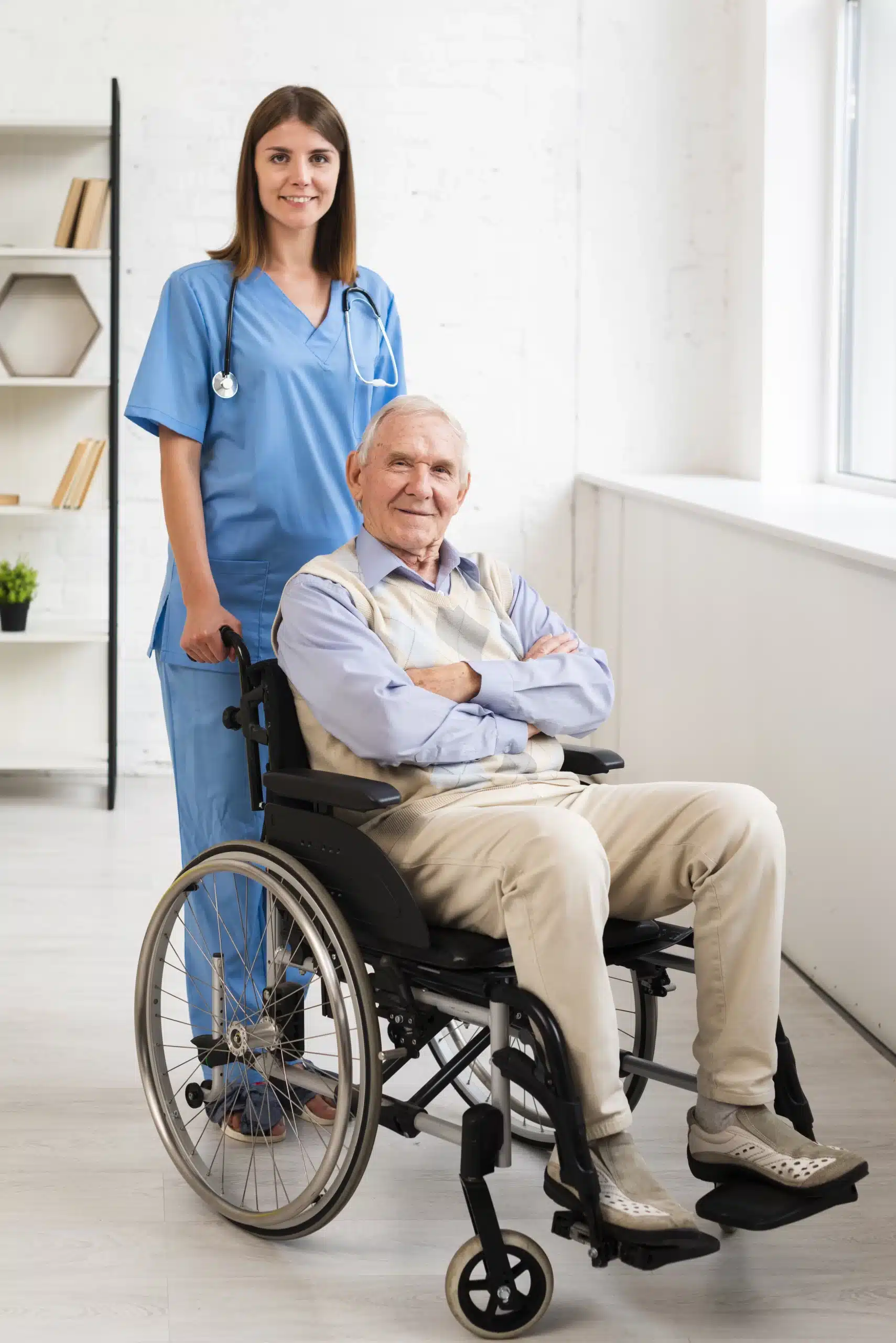 Female caregiver assisting elderly man in wheelchair