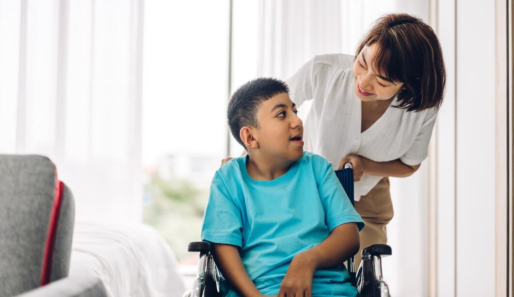 Child happy that he is receiving assistance from an at home caregiver
